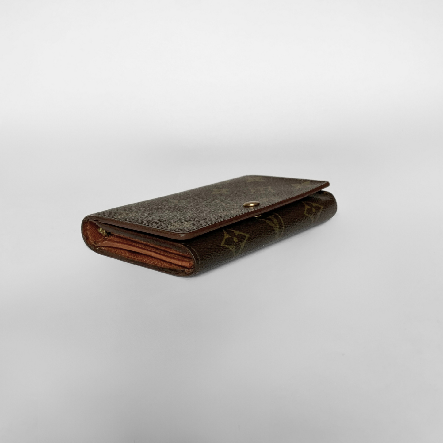 Brown leather wallet on a light gray background
