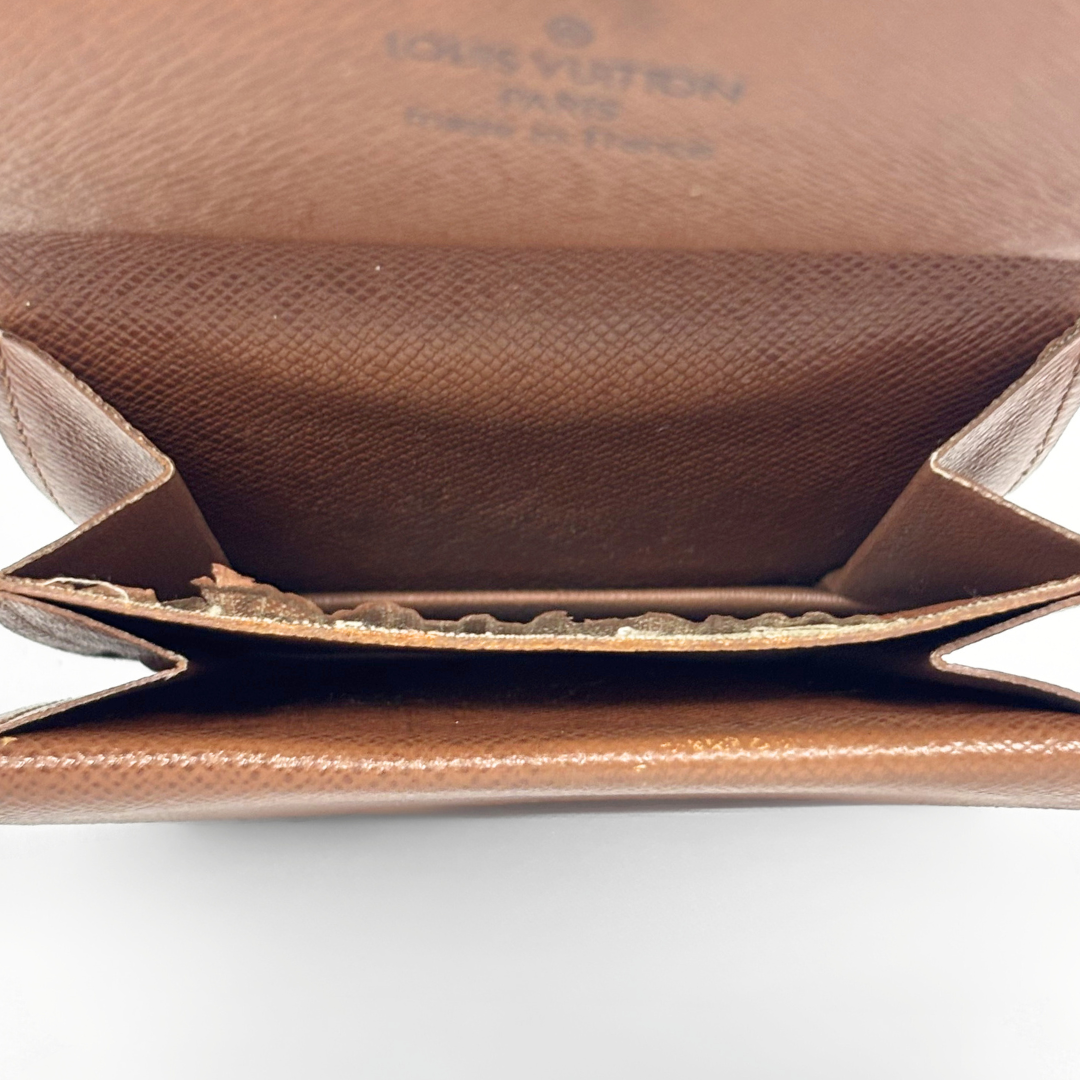 Close-up of a brown leather Louis Vuitton handbag on a white background
