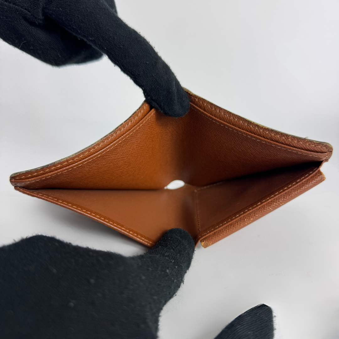 Louis Vuitton Flap Wallet on a white background