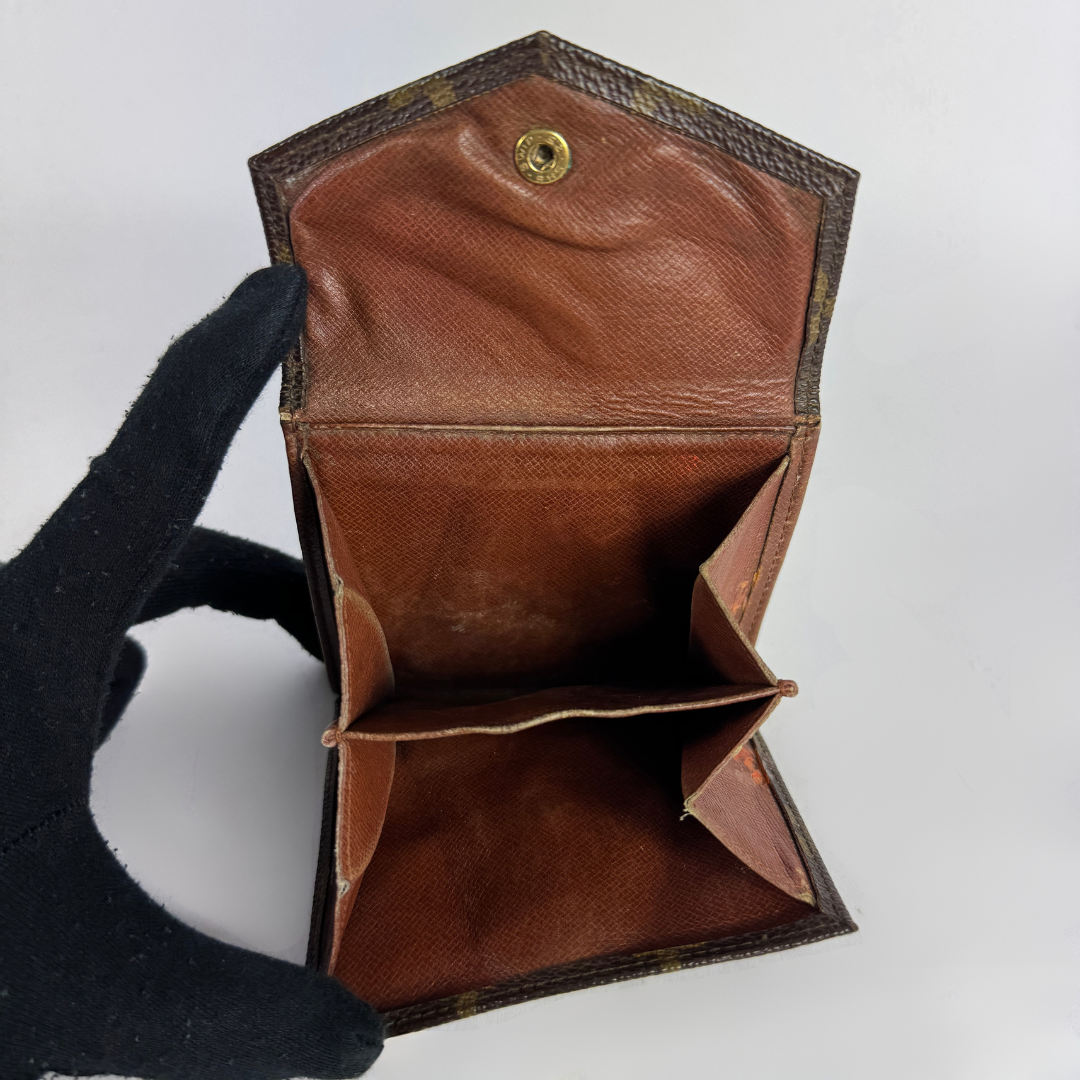 Louis Vuitton Druk Wallet on a white background
