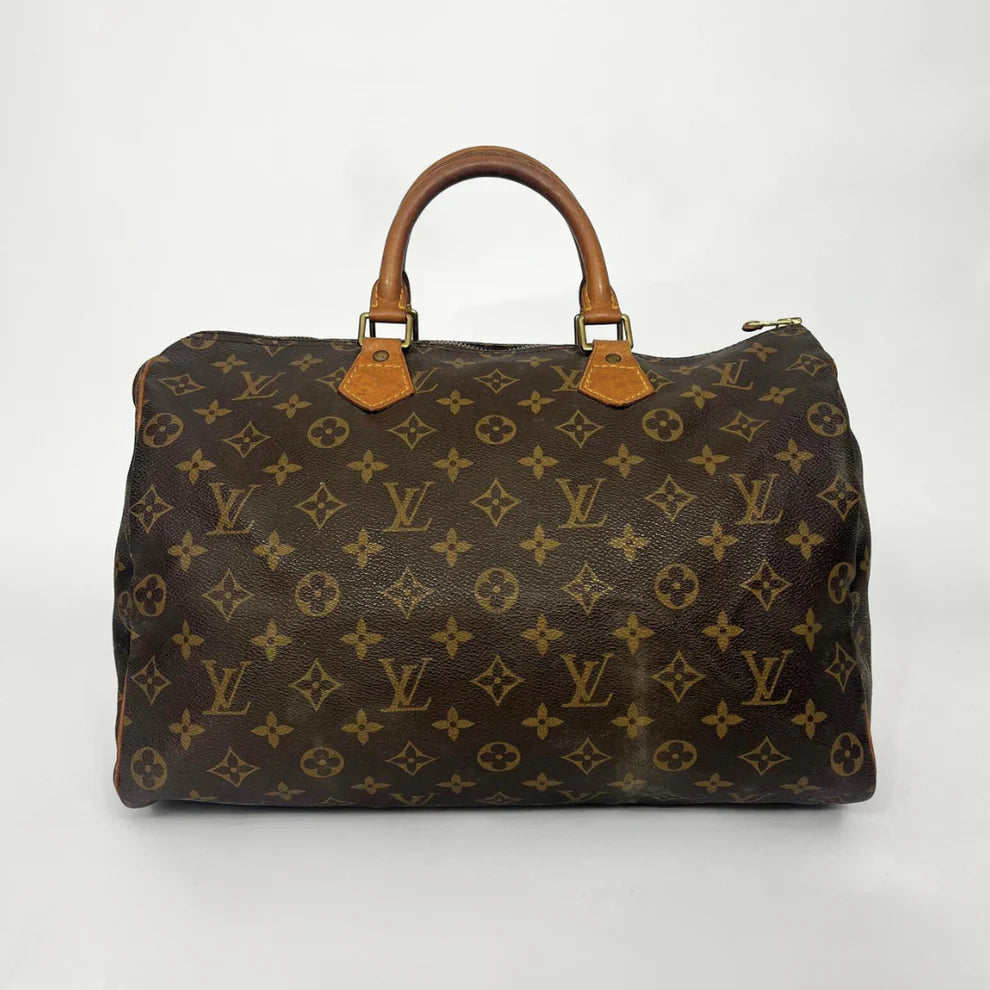 Brown Louis Vuitton bag with monogram pattern on a white background