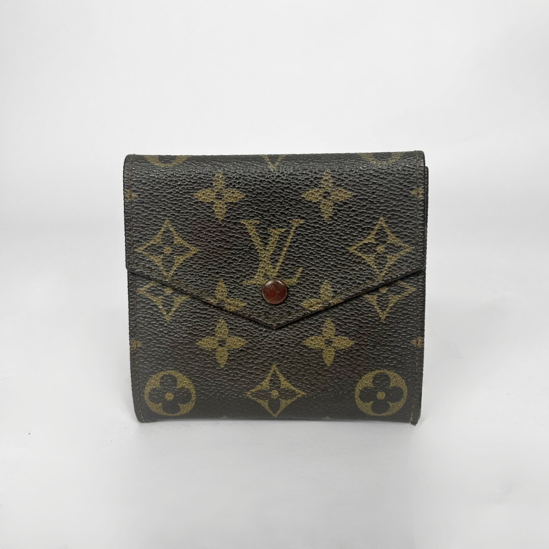 Louis Vuitton wallet with monogram pattern on a white background