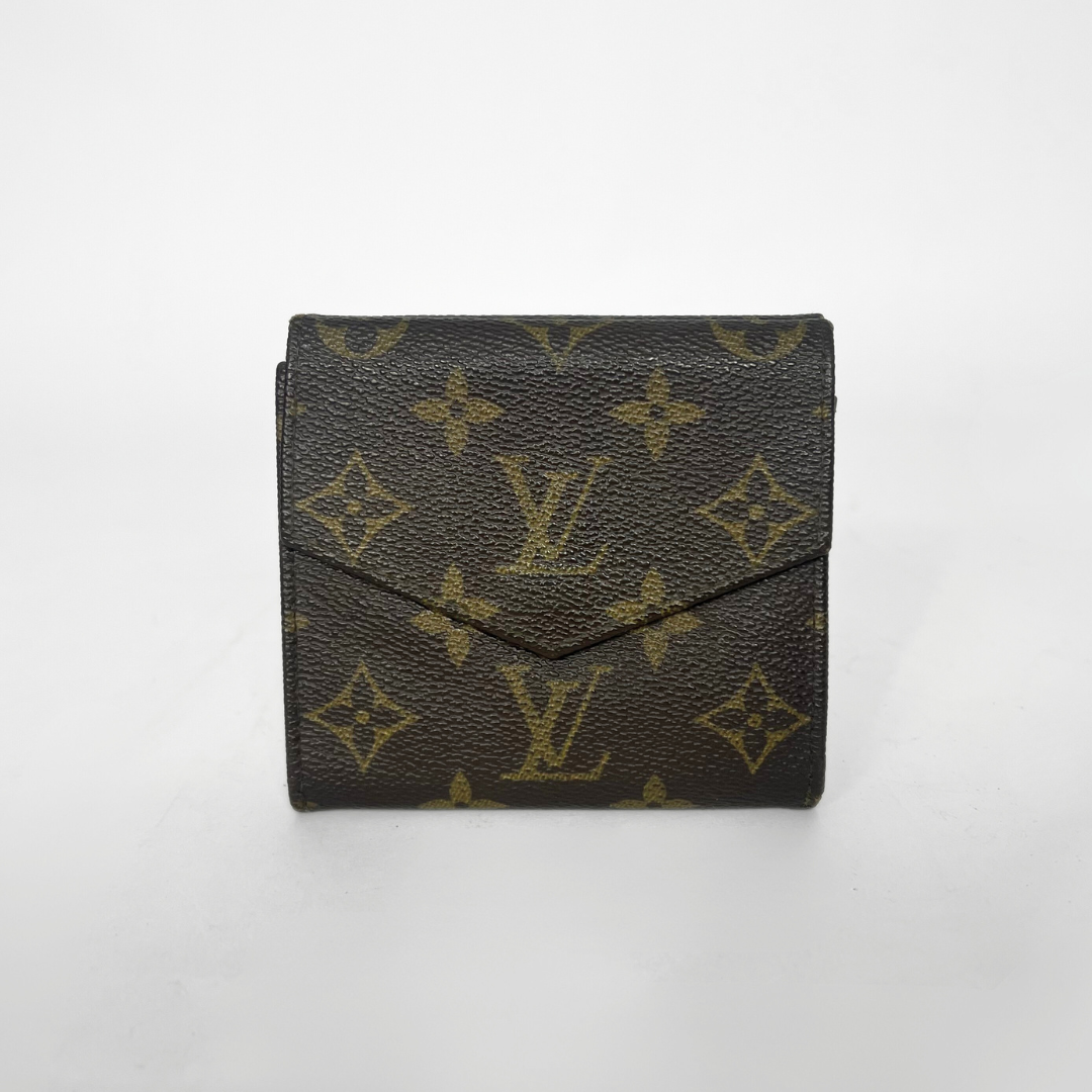 Louis Vuitton wallet with monogram pattern on a white background