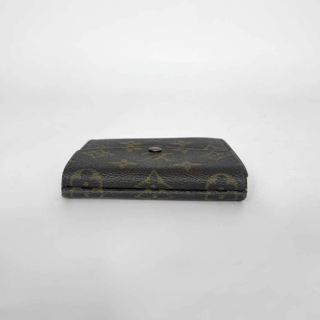 Black wallet with yellow monogram pattern on a white background