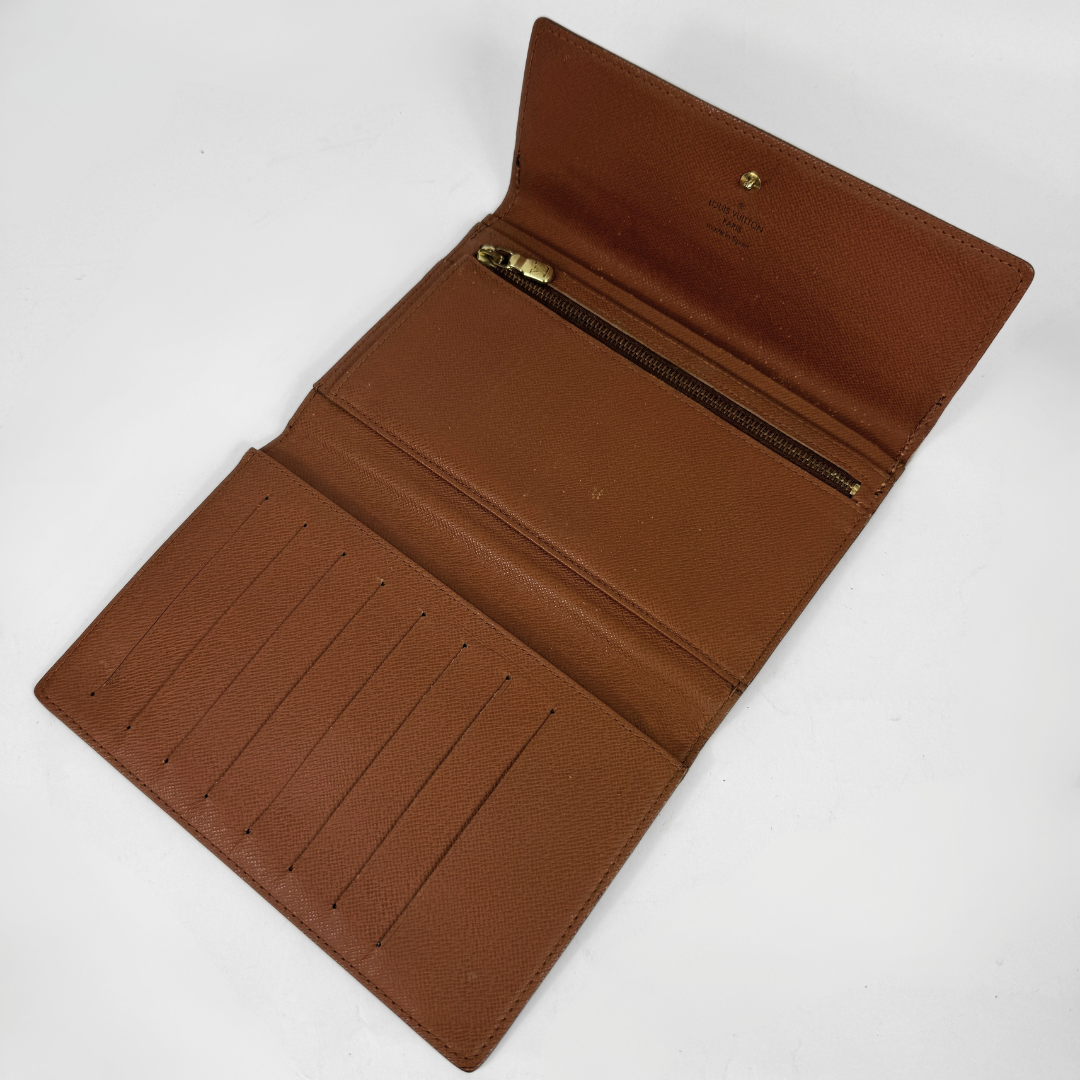 Louis Vuitton Wallet in front of white background