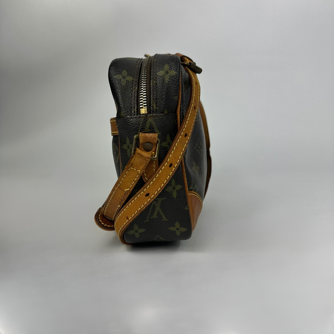 Brown handbag with gold monogram pattern 
