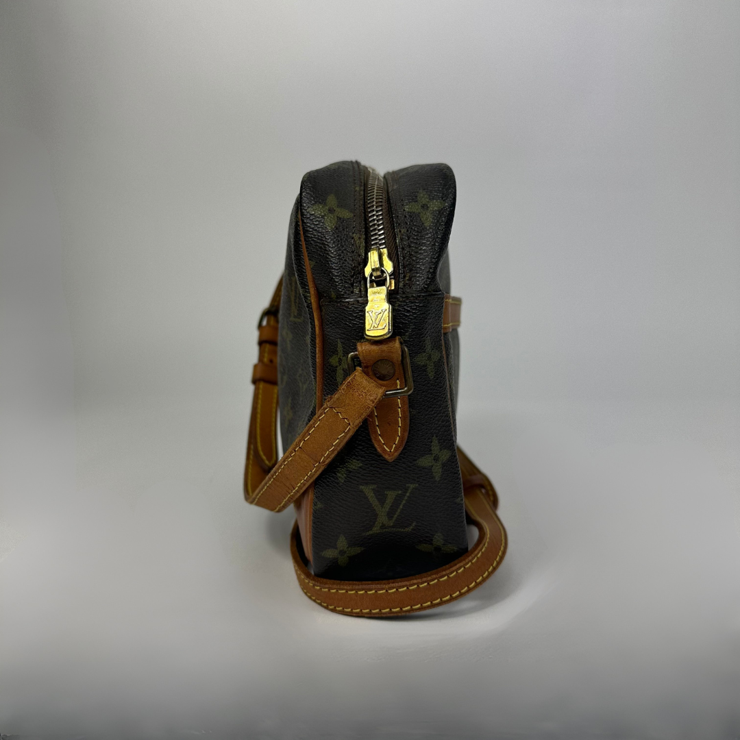 Brown handbag with gold monogram pattern 