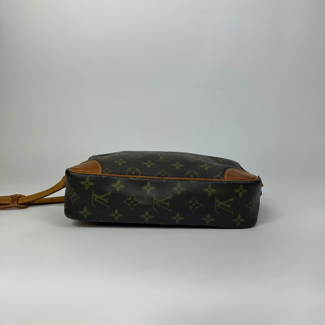 Brown handbag with gold monogram pattern 