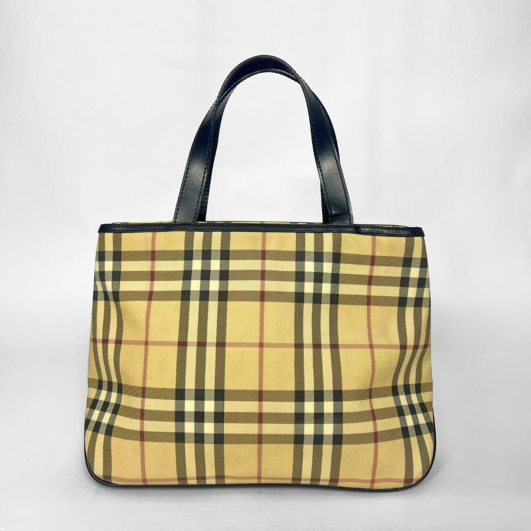 Plaid tote bag with black handles on a white background