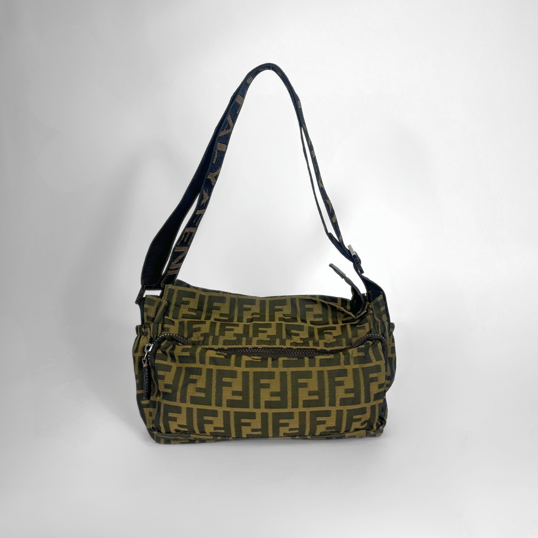 Green handbag with a pattern on a white background
