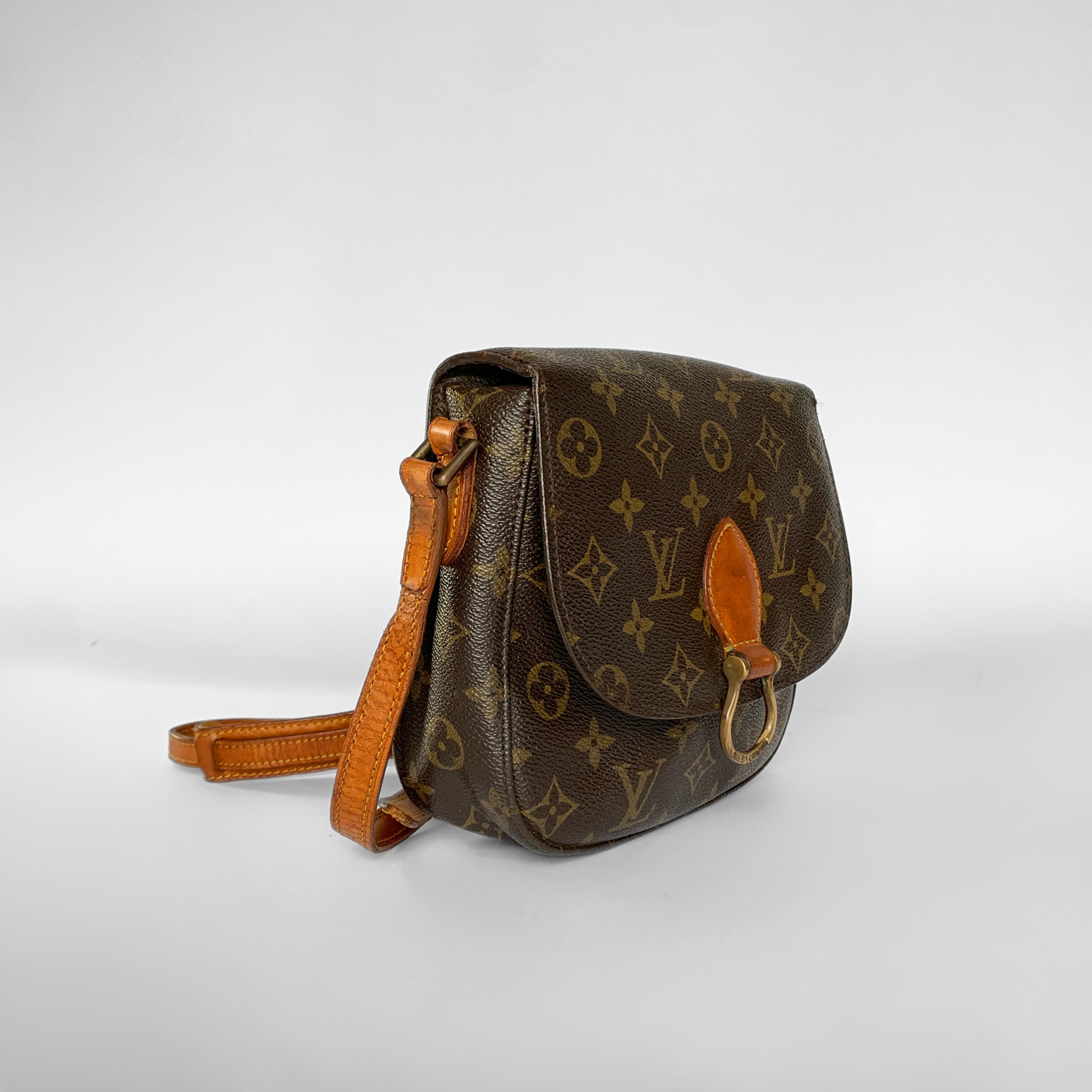 Brown leather handbag with orange accents on a white background