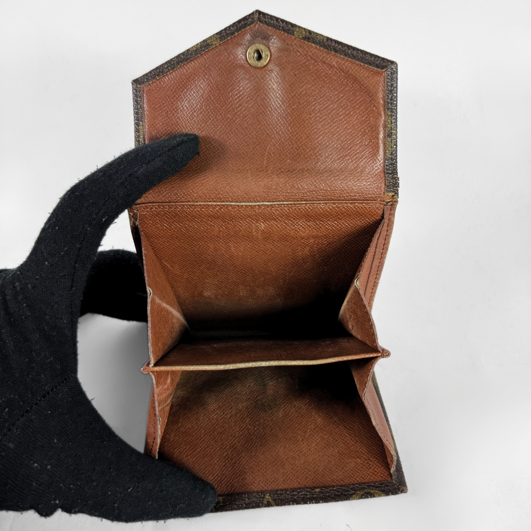 Louis Vuitton Druk Wallet on a white background