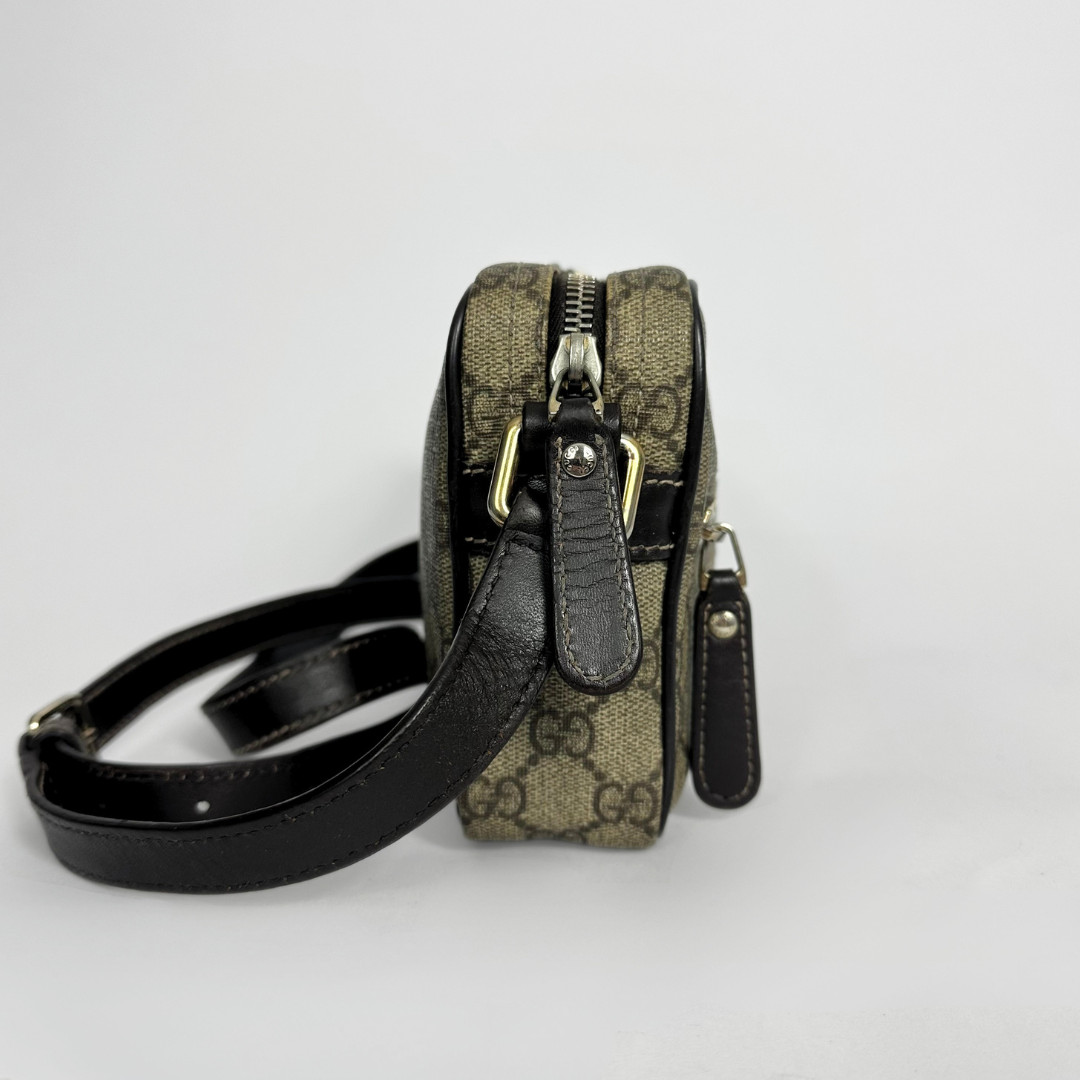 Gucci handbag with monogram pattern on a white background