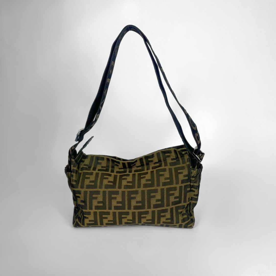 Designer handbag with a distinctive pattern on a white background