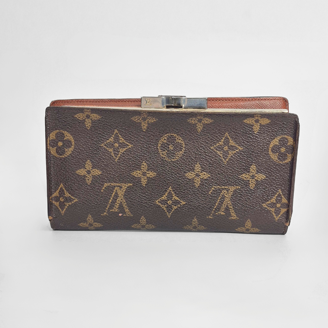 Designer wallet with monogram pattern on a white background
