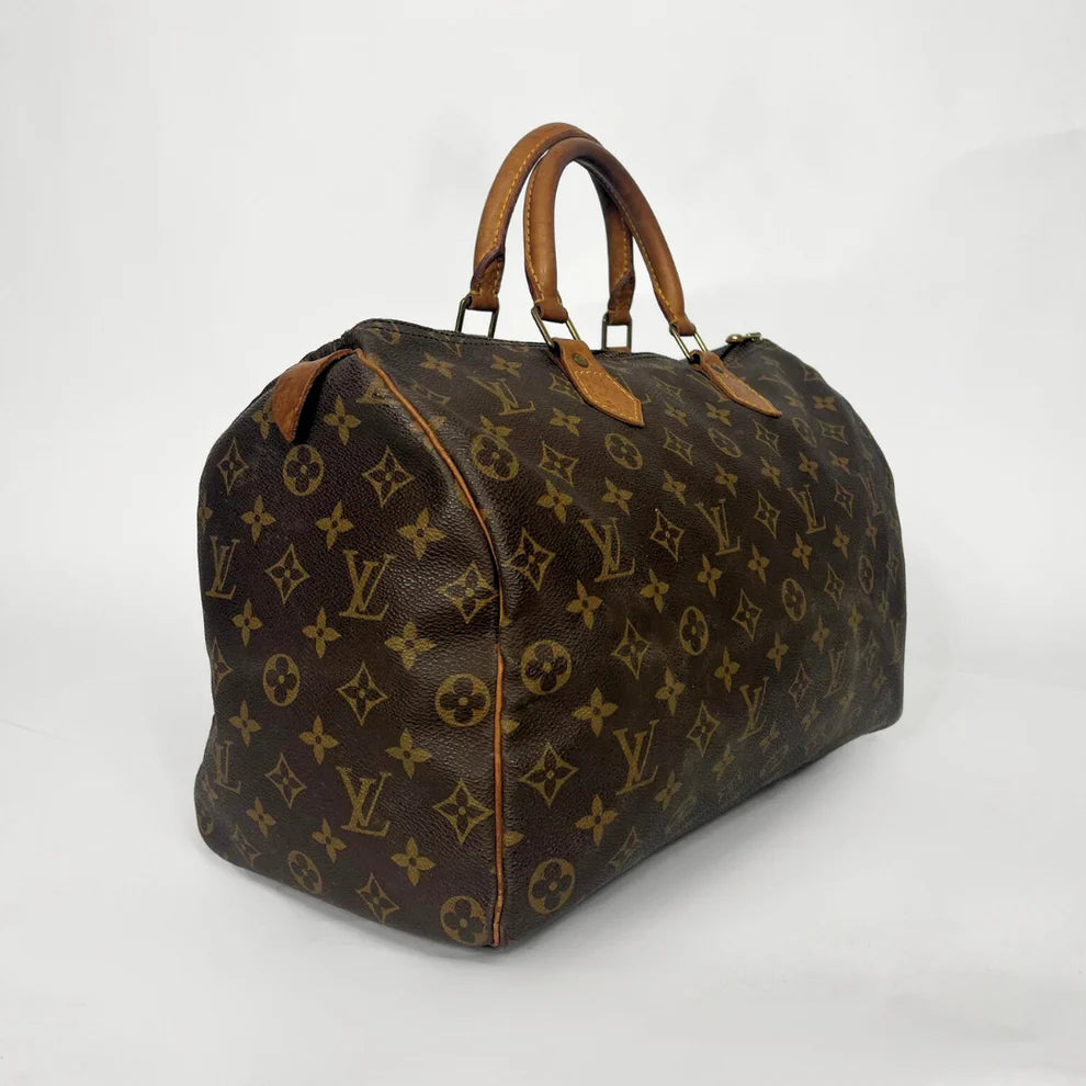 Brown Louis Vuitton bag with monogram pattern on a white background