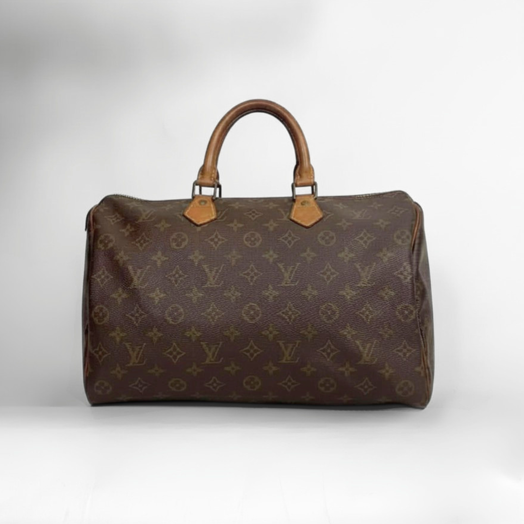 A classic Louis Vuitton monogram canvas duffel bag with brown leather handles and gold-tone hardware, photographed against a neutral light gray background.