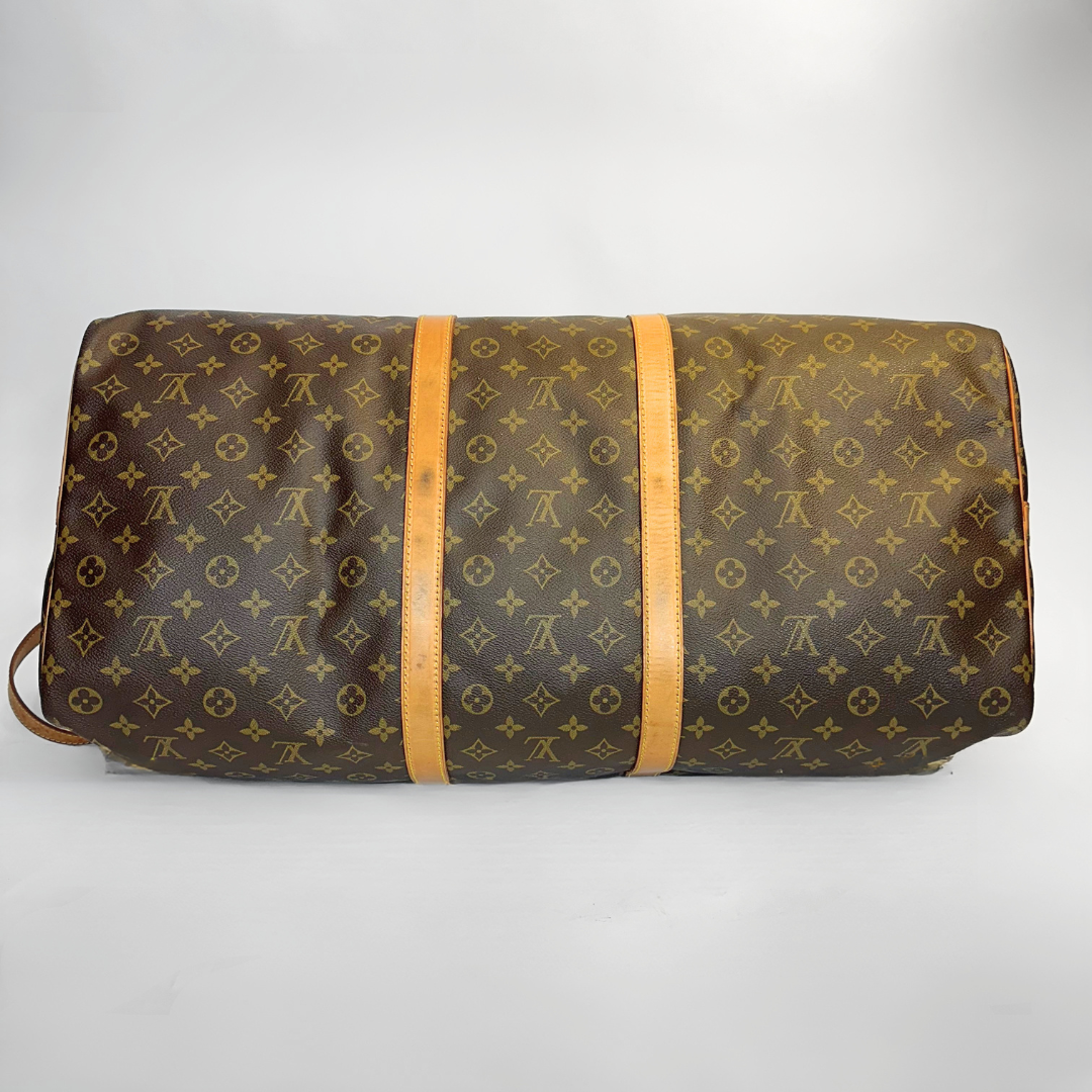 Brown monogram patterned bag with tan straps on a light gray background
