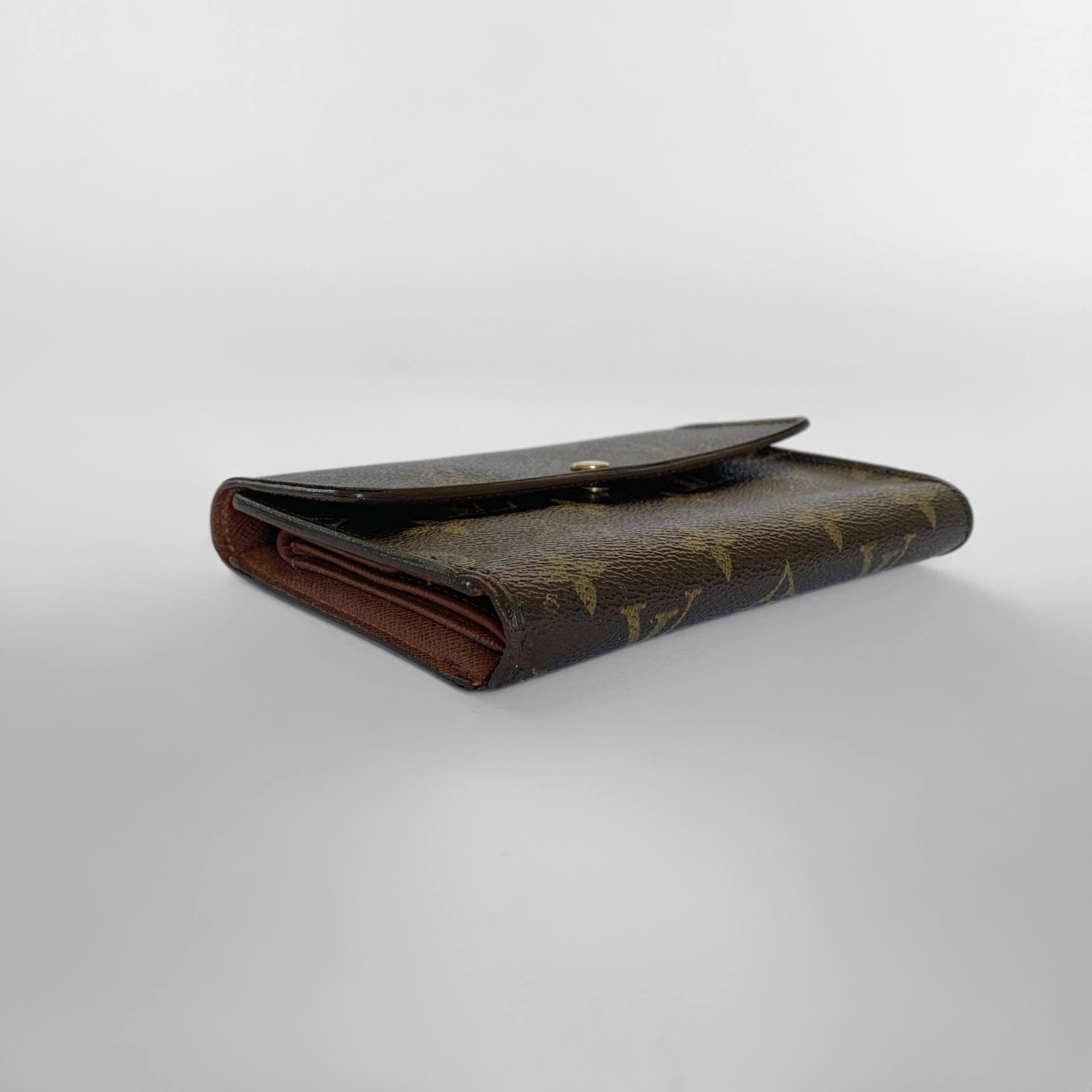 Louis Vuitton International Wallet Medium on a white background