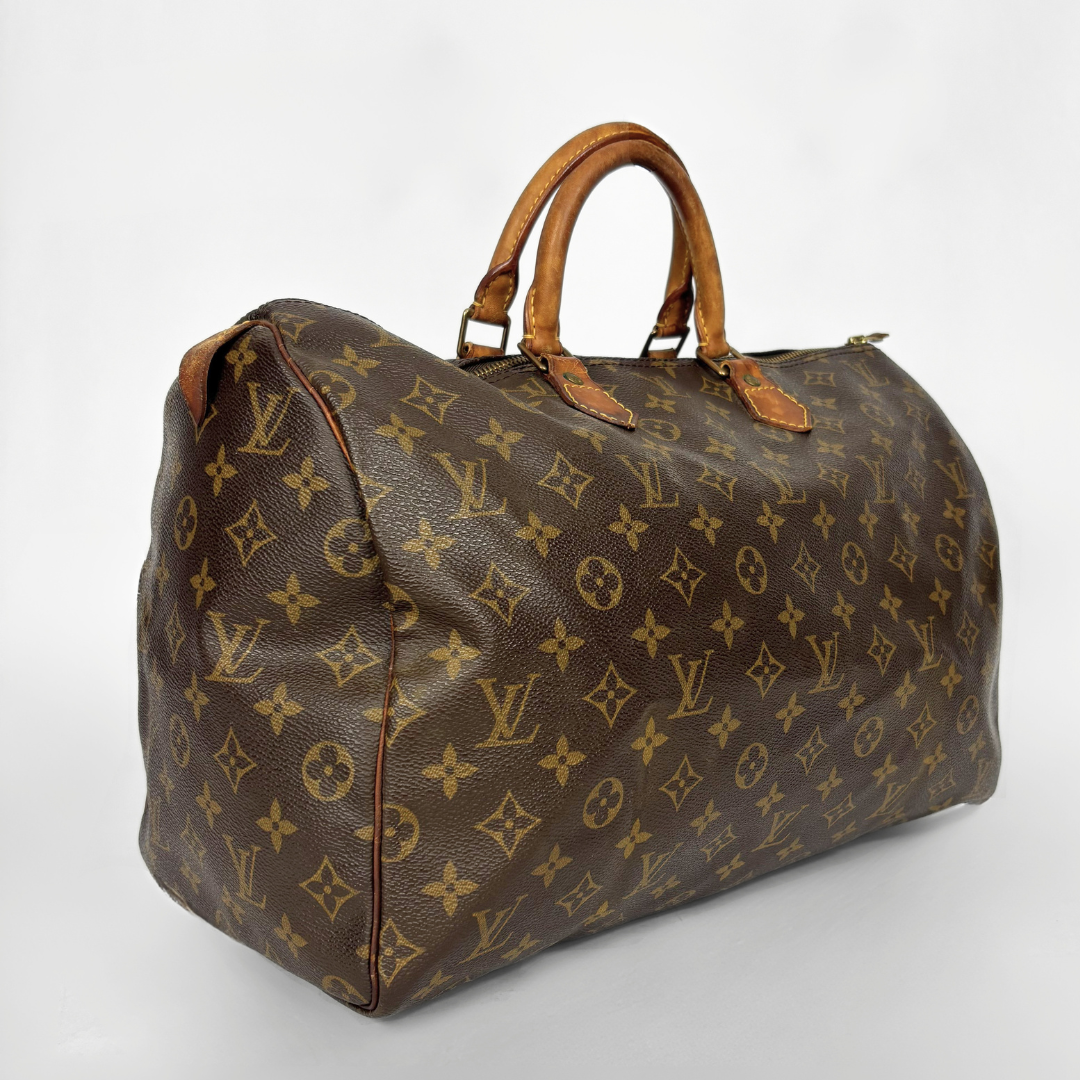 Brown Louis Vuitton bag with monogram pattern on a white background
