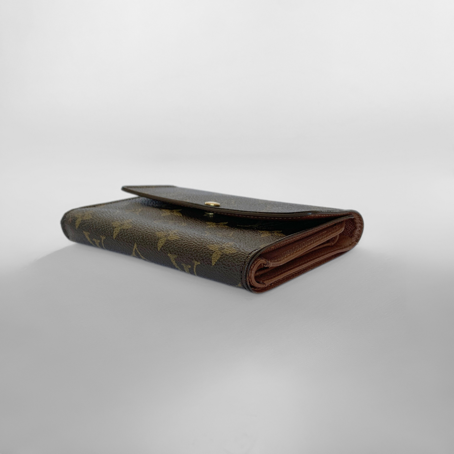 Louis Vuitton International Wallet Medium on a white background