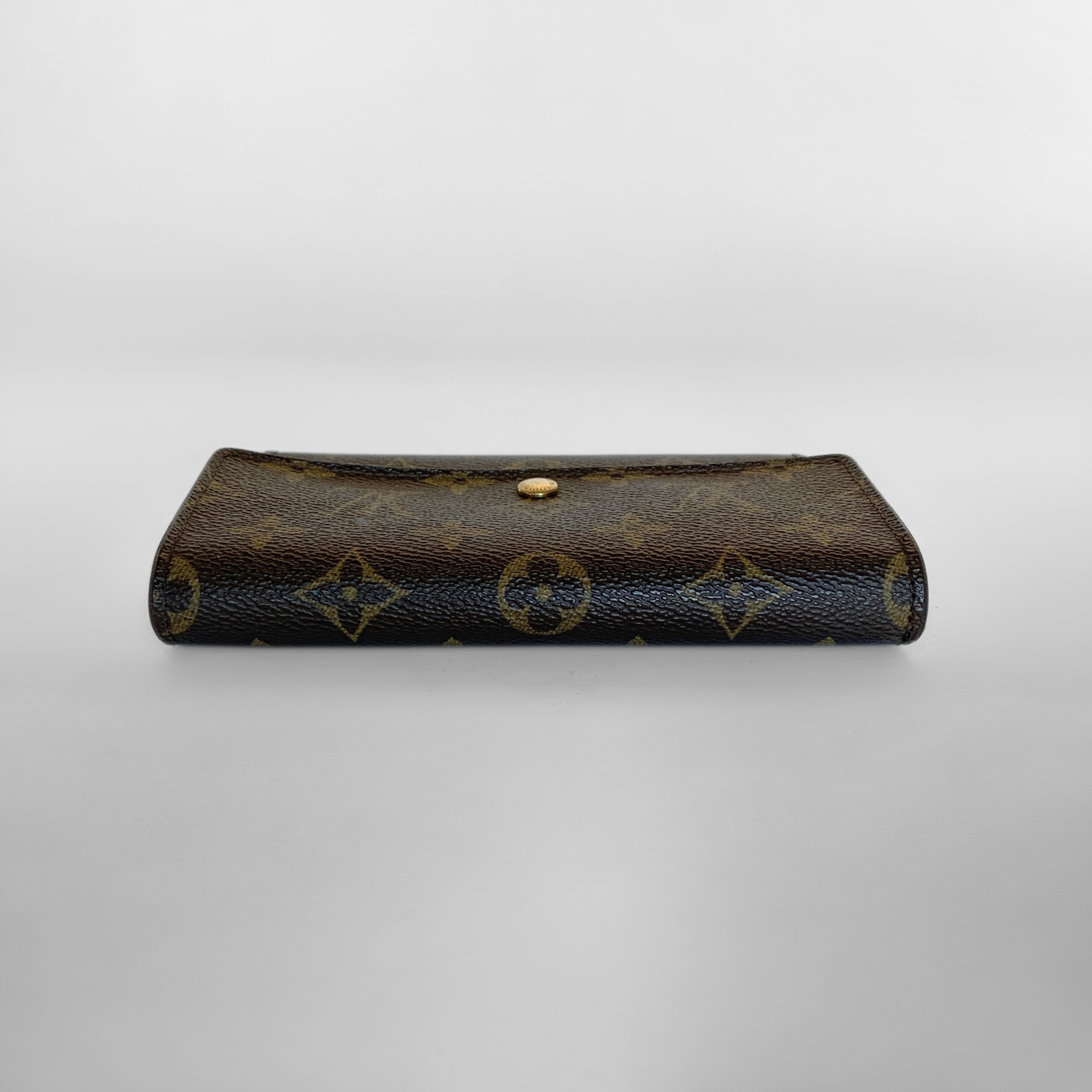 Louis Vuitton International Wallet Medium on a white background