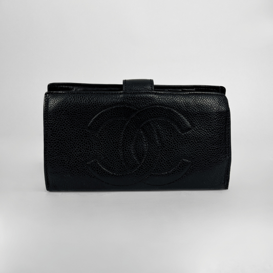 A black pebbled leather clutch bag with an embossed interlocking CC logo on the front, photographed against a neutral light gray background.