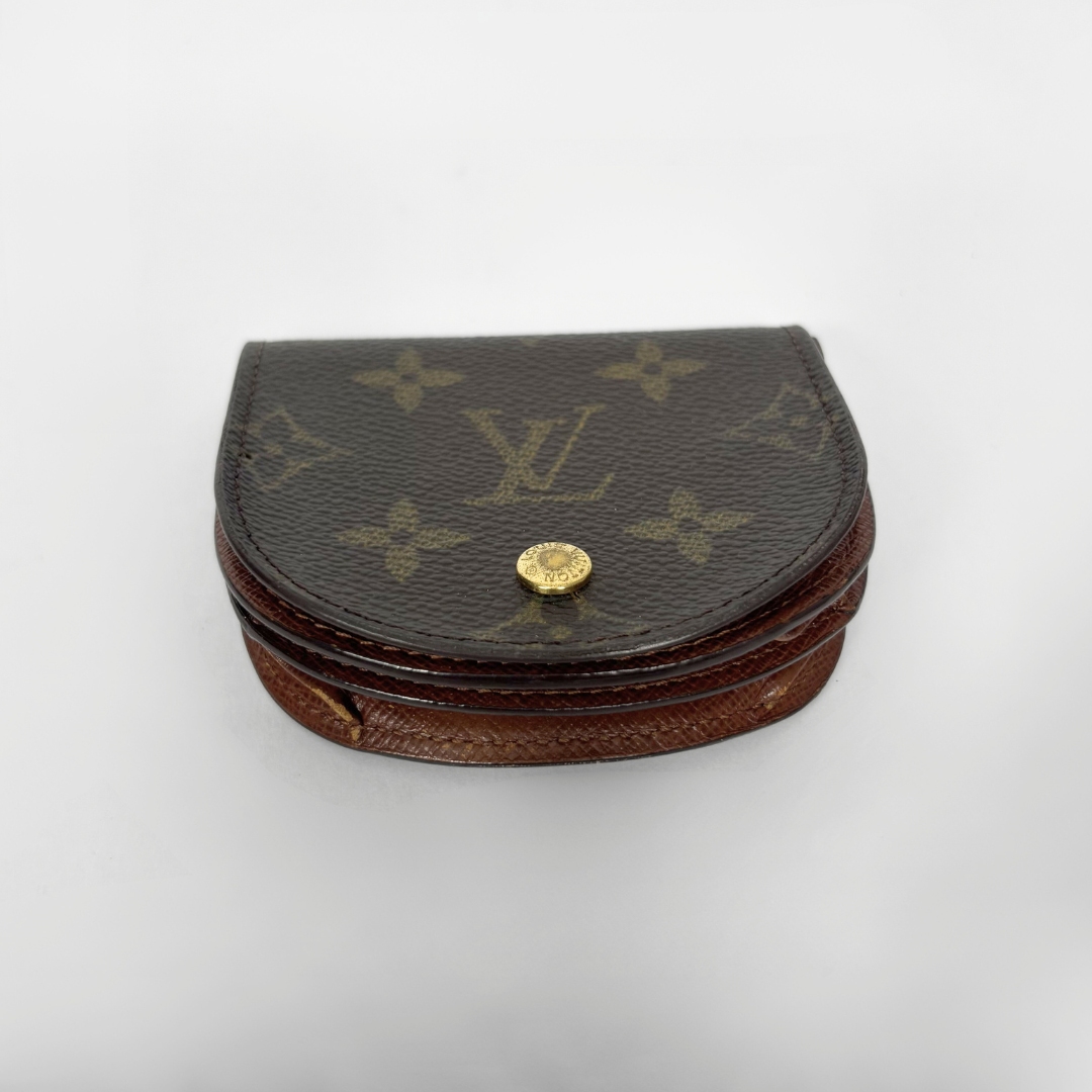 Louis Vuitton monogrammed jewelry box on a white background