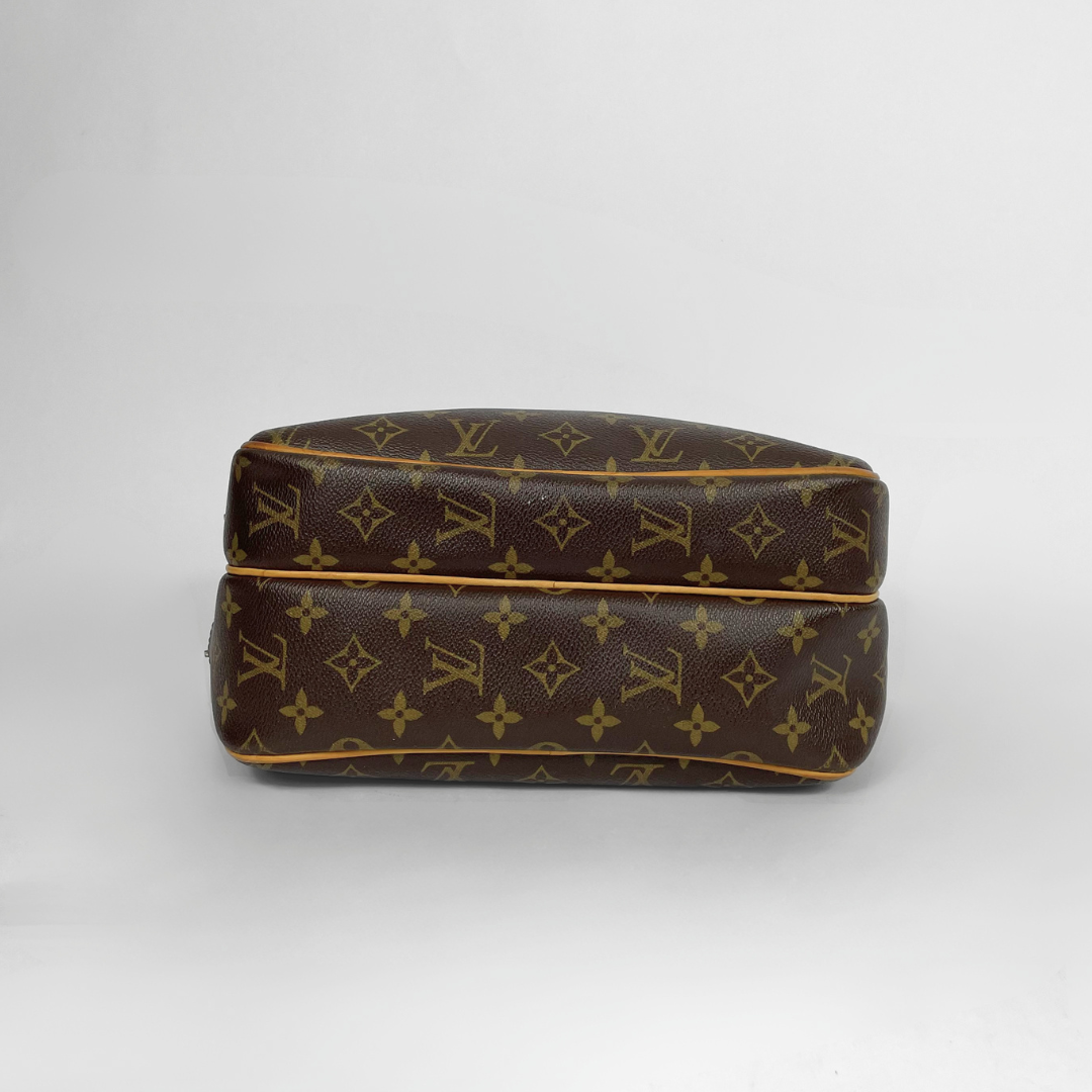 Louis Vuitton Reporter PM Monogram Canvas on a white background