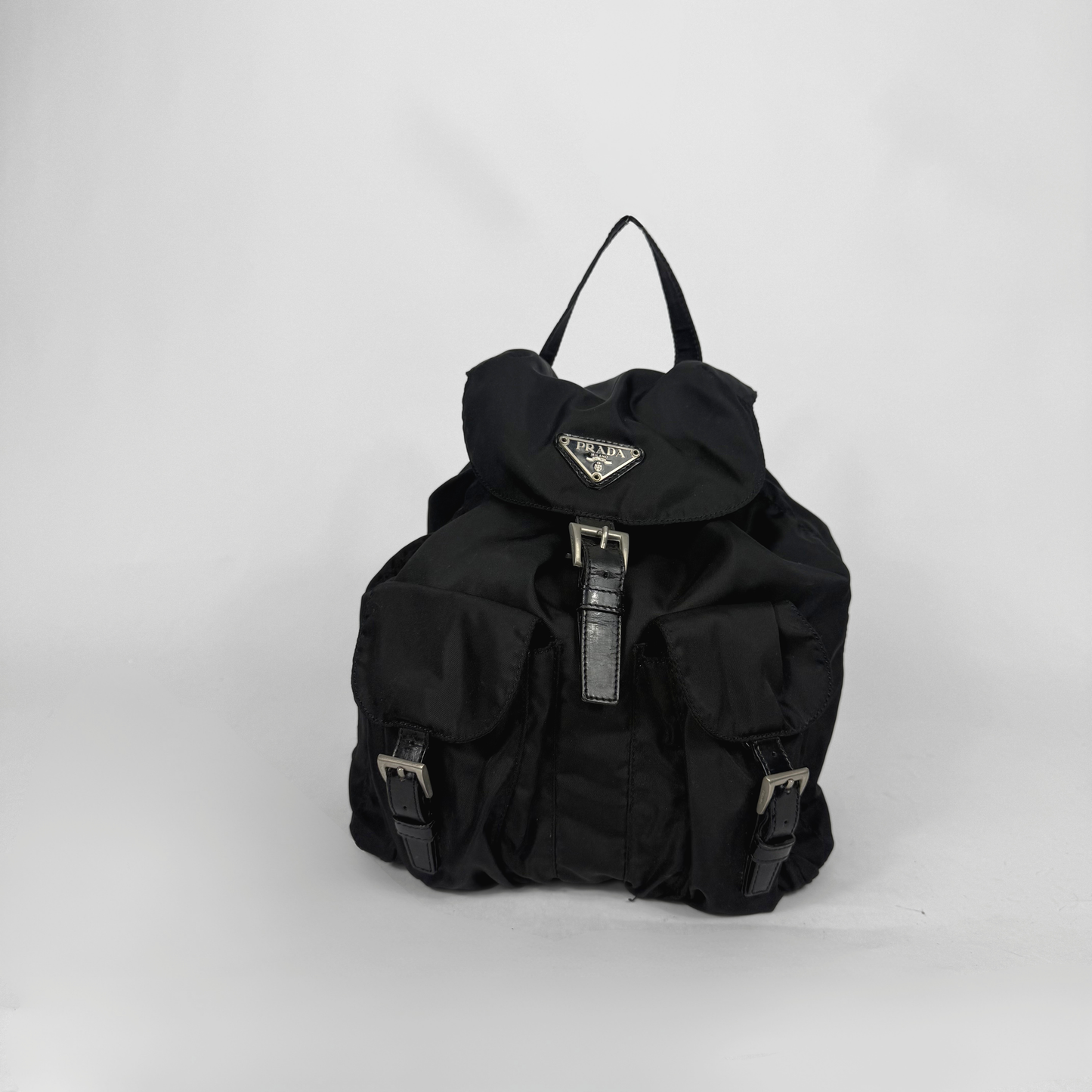 Black backpack with a brand logo on a white background
