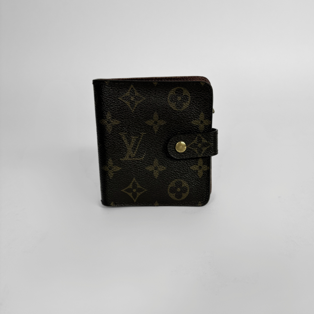 Brown LV wallet with gold accents on a light gray background