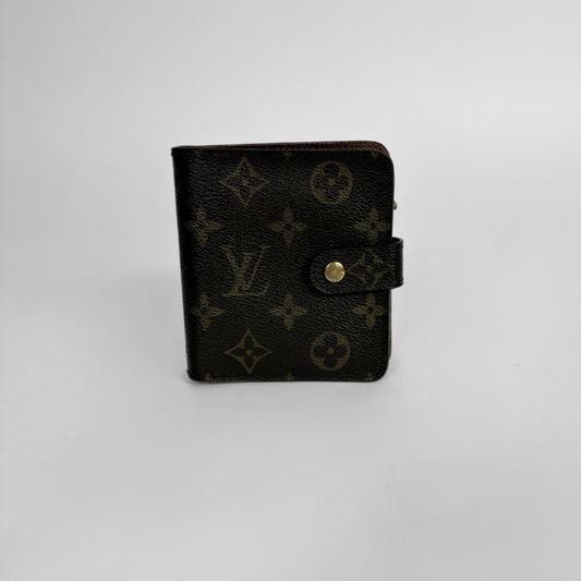 Brown LV wallet with gold accents on a light gray background