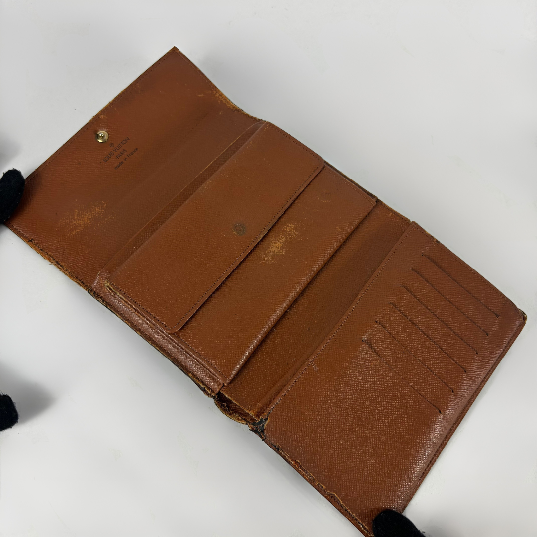 Louis Vuitton International Wallet Medium on a white background