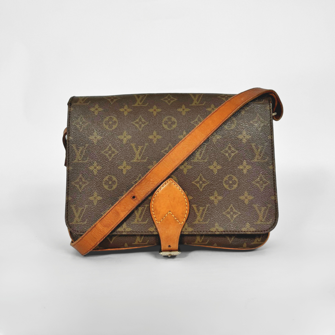Brown Louis Vuitton bag with monogram pattern on a white background