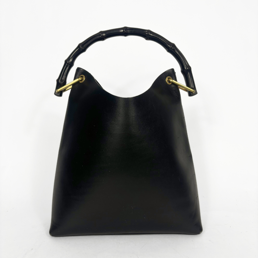 Gucci vintage black leather hobo hag with a dark wood bamboo top handle and gold-tone hardware.