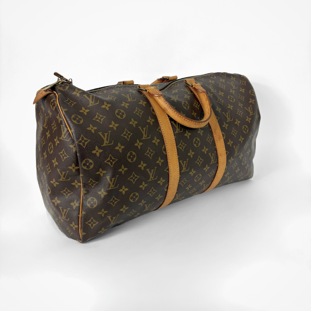 Brown Louis Vuitton bag with monogram pattern on a white background