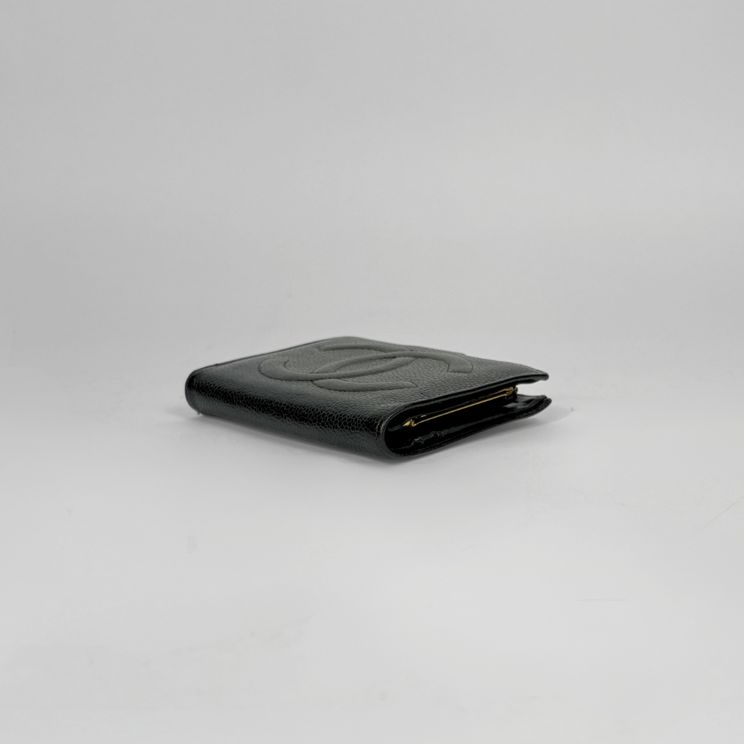 Black leather wallet on a light gray background