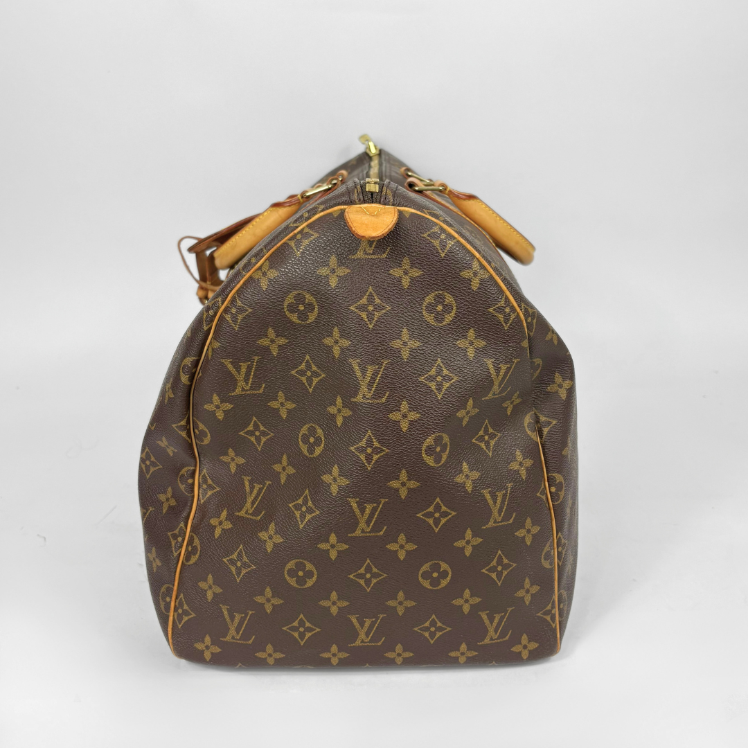 Brown Louis Vuitton bag with monogram pattern on a white background