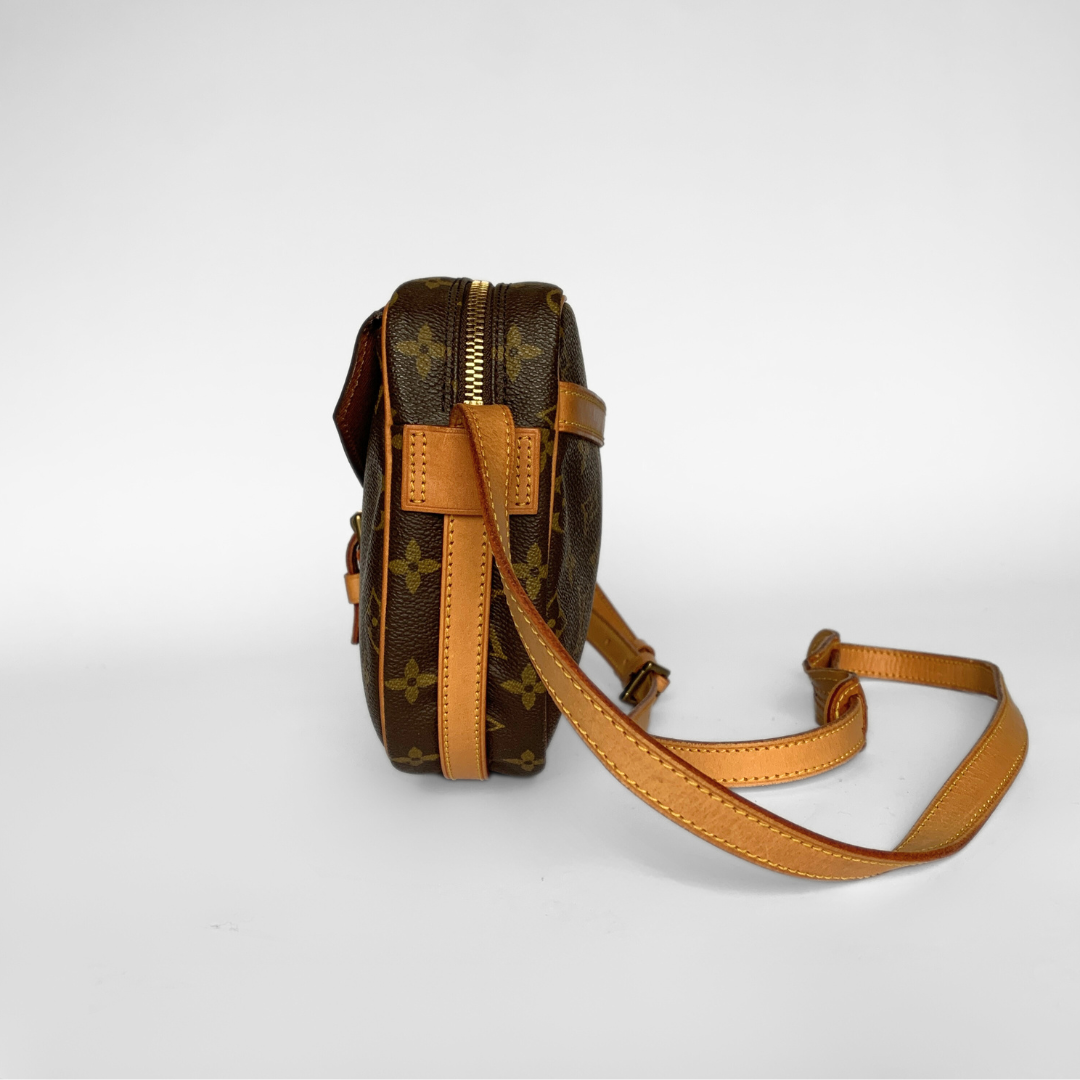 Brown leather bag with monogram pattern on a white background