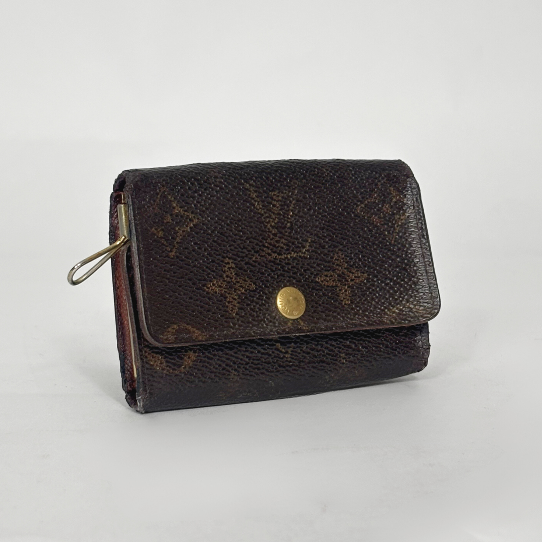 Brown wallet with gold accents on a light gray background
