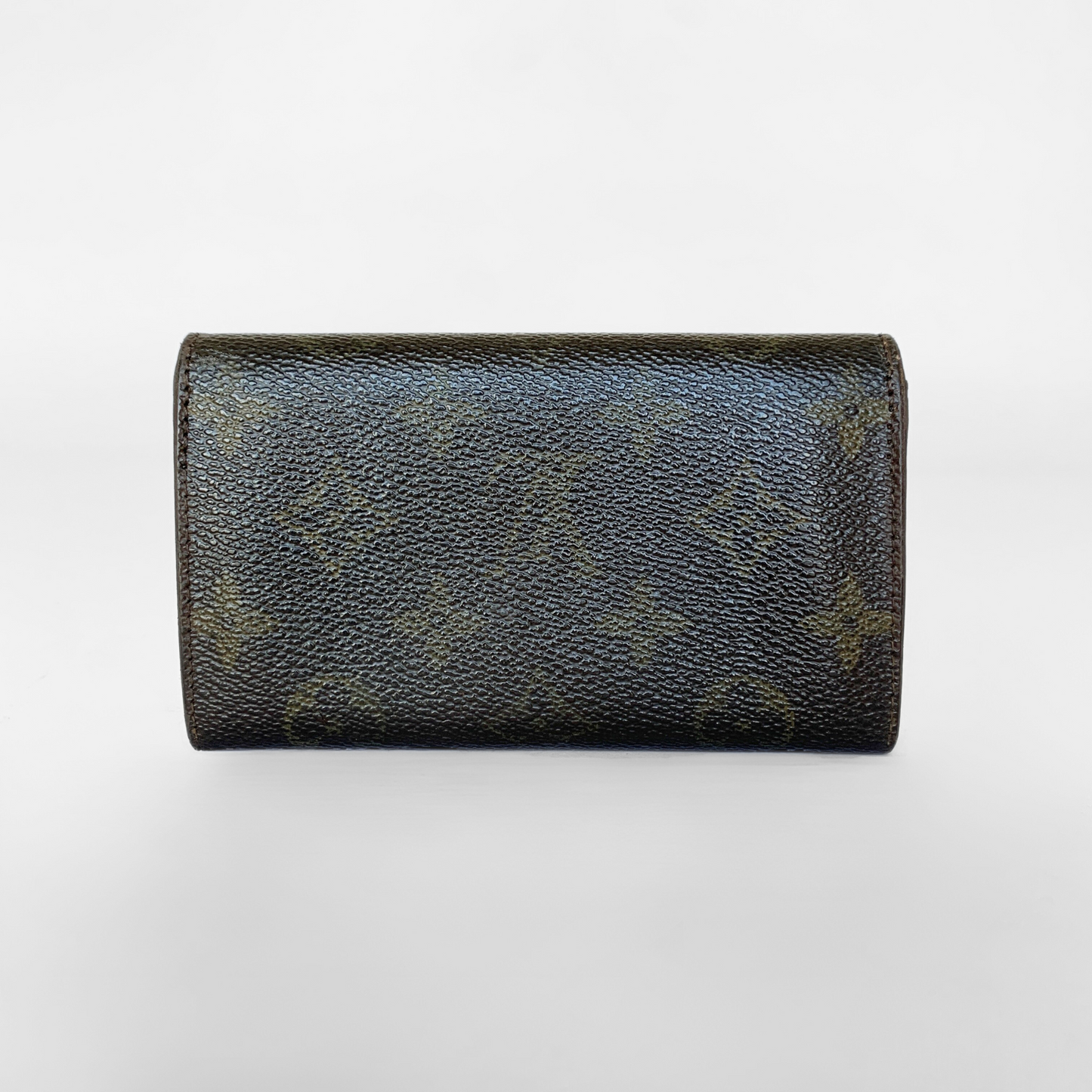 Black leather wallet with a gold button on a white background