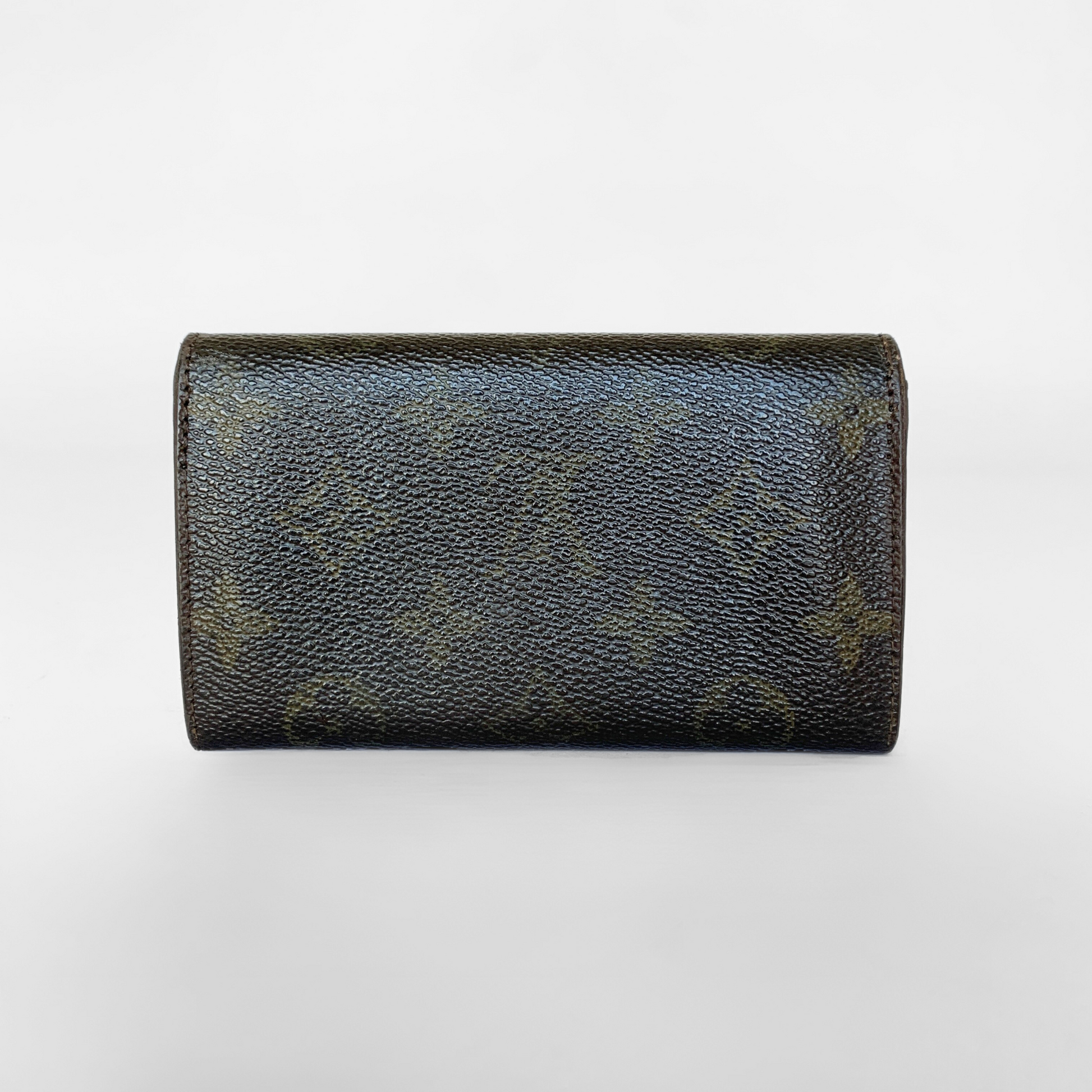 Black leather wallet with a gold button on a white background