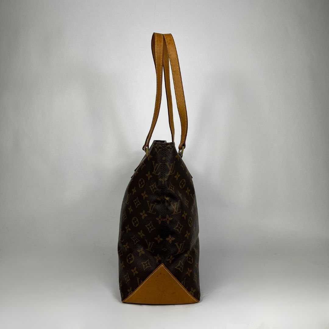 A Louis Vuitton monogram canvas shoulder bag with tan leather trim and a single shoulder strap, photographed against a neutral light gray background.