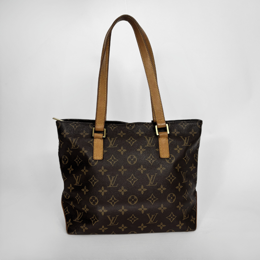 Louis Vuitton monogram canvas tote bag with tan leather shoulder straps and gold-tone hardware, photographed against a light gray studio background.