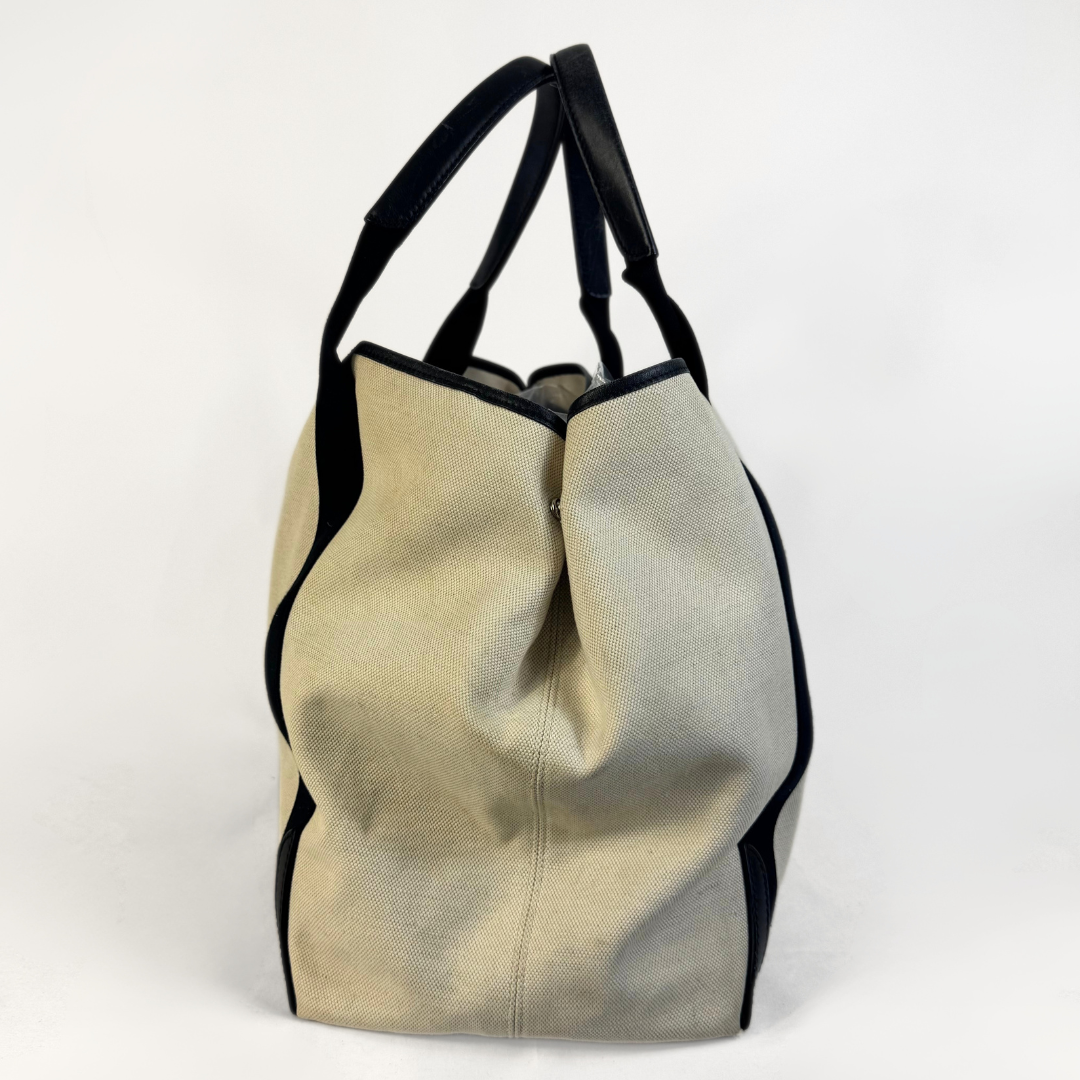 Balenciaga tote bag with black accents on a light gray background