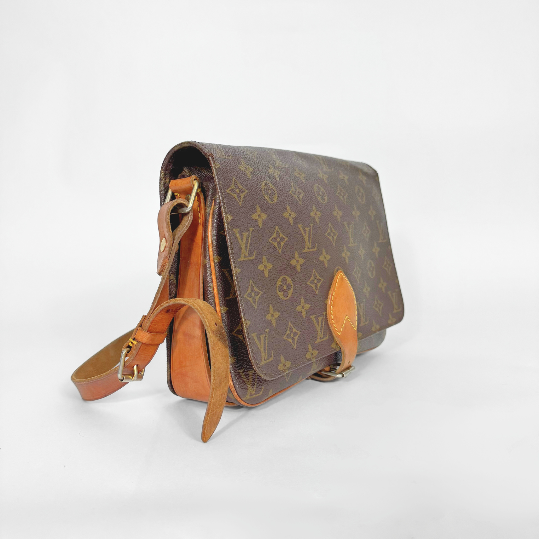 Brown leather handbag with visible brand logo on a white background