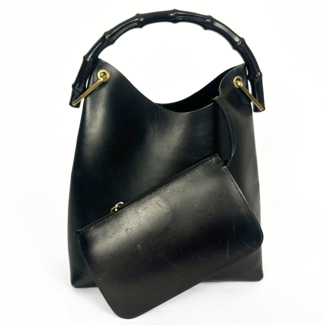 Gucci vintage black leather hobo hag with a dark wood bamboo top handle and gold-tone hardware.