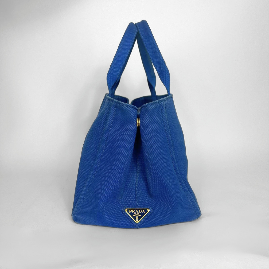 Blue handbag with Prada logo on a white background