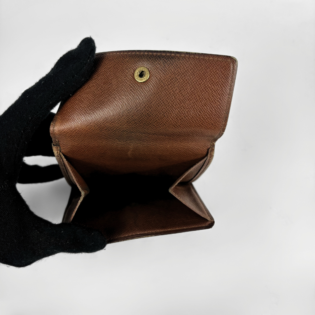 Louis Vuitton Druk Wallet on a white background