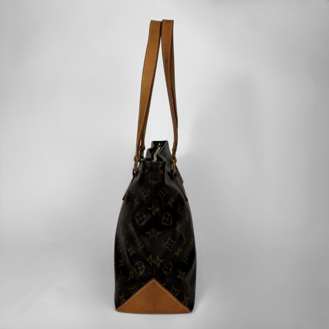 A Louis Vuitton monogram canvas shoulder bag with tan leather trim and straps, shown against a plain light gray background.
